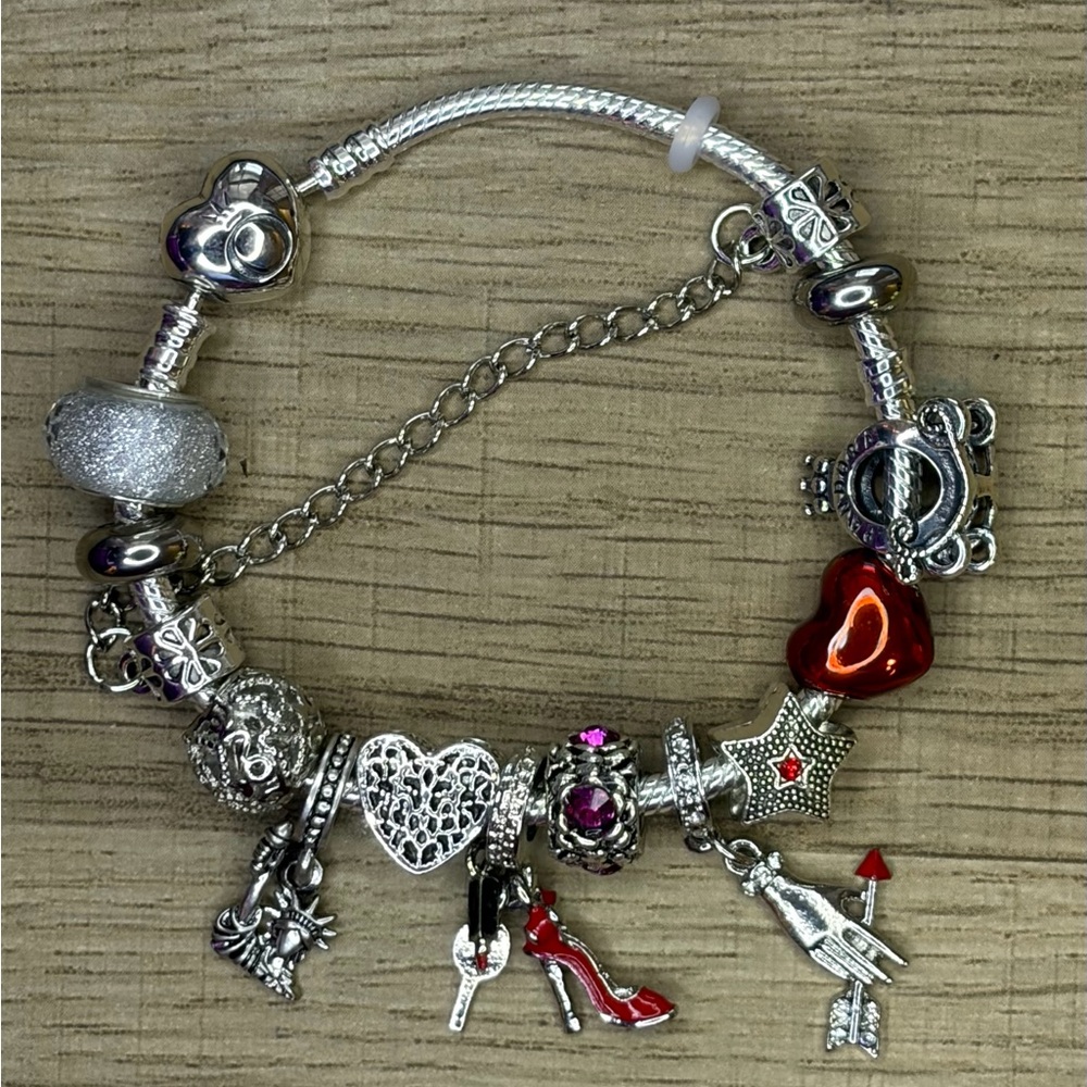 Pandora Bracelet 925 Silver Ale + assorted charms + original Pandora bag.